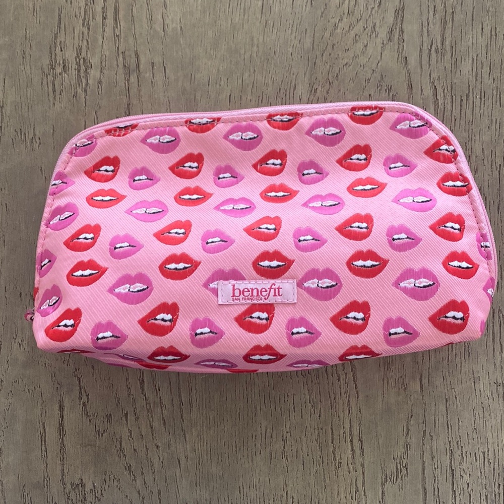 Benefit makeup bag lip design with braced teeth 😬